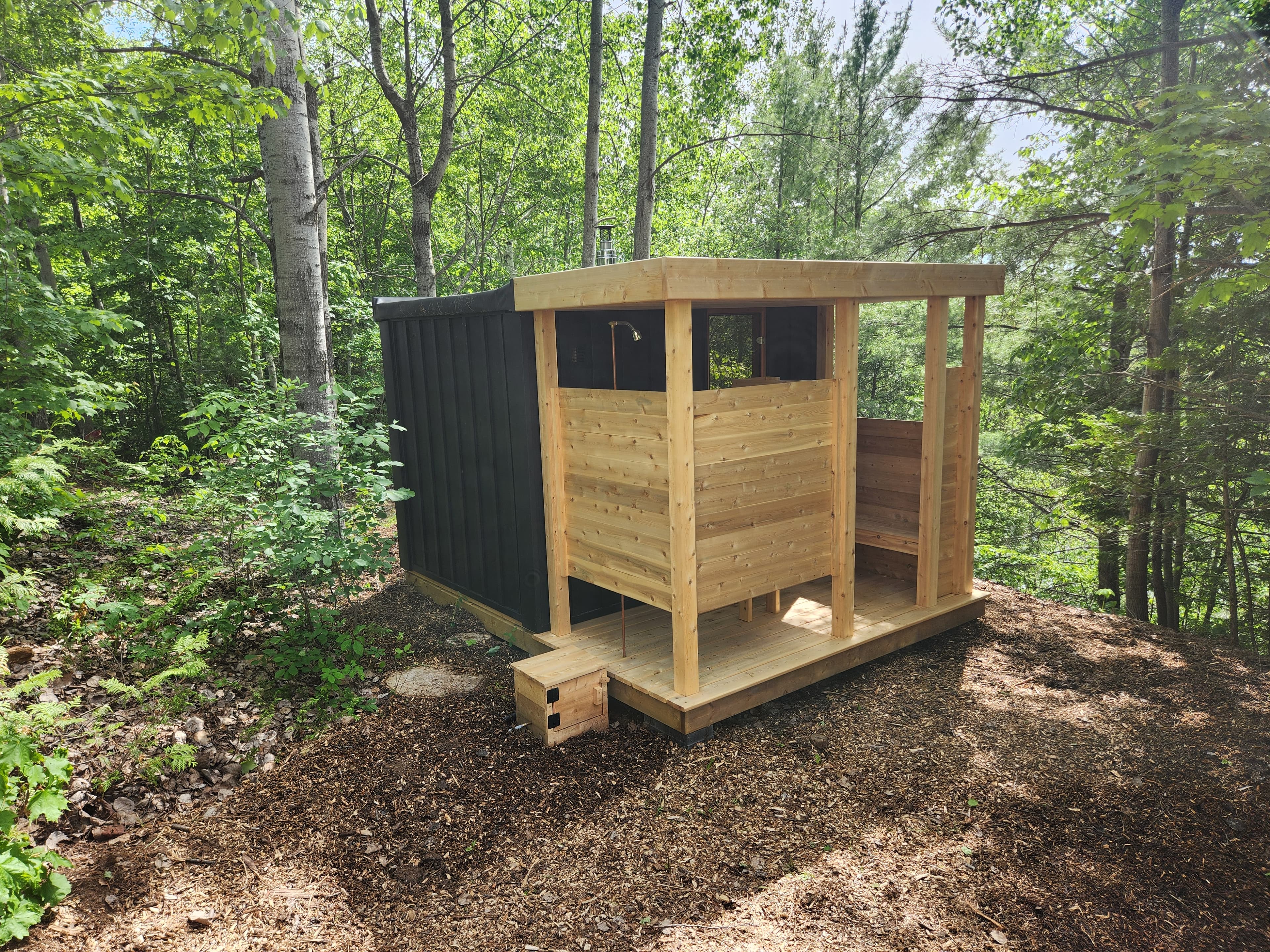 Cedar sauna exterior with custom porch